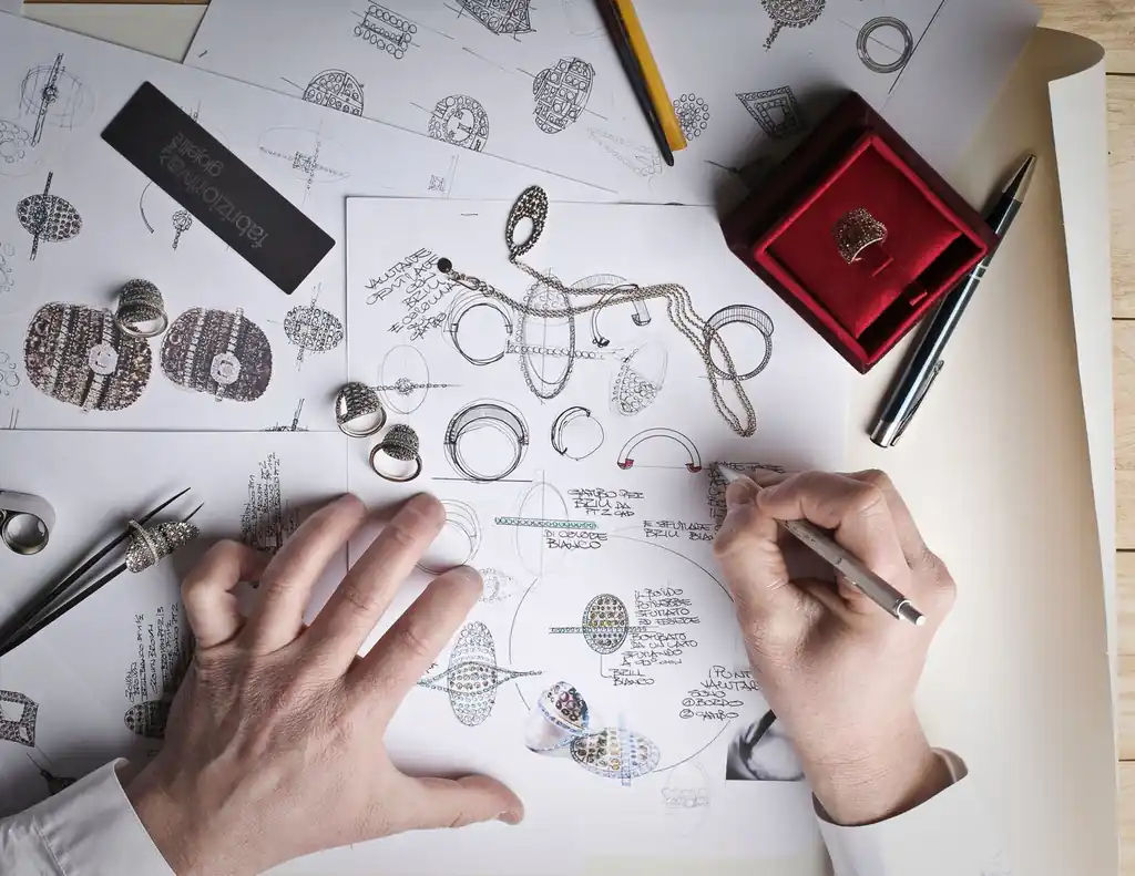Jewelry design sketches on a desk