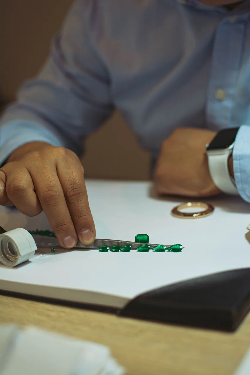 Jeweler examining raw opal material